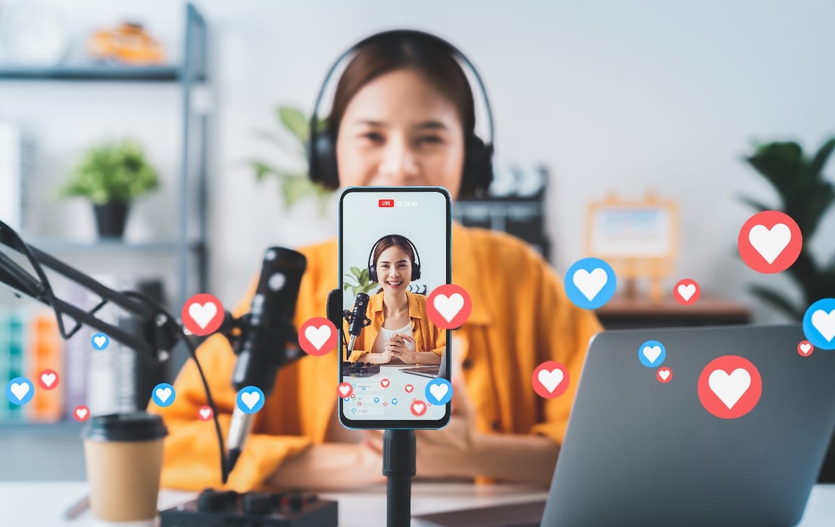 Young woman running live marketing video</p>
<p>