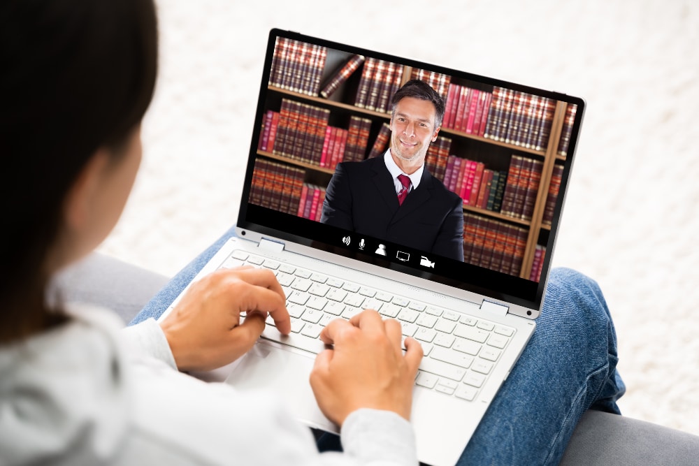 Woman watching law firm ad on computer