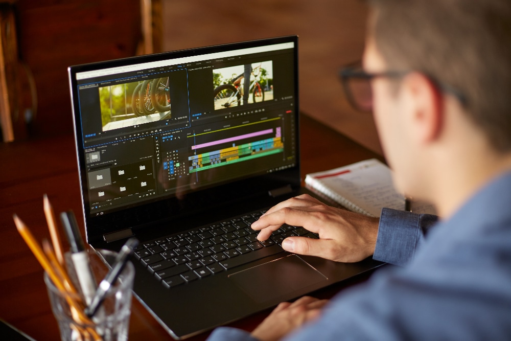 Video editor doing text-based editing in Adobe Premiere</p>
<p>