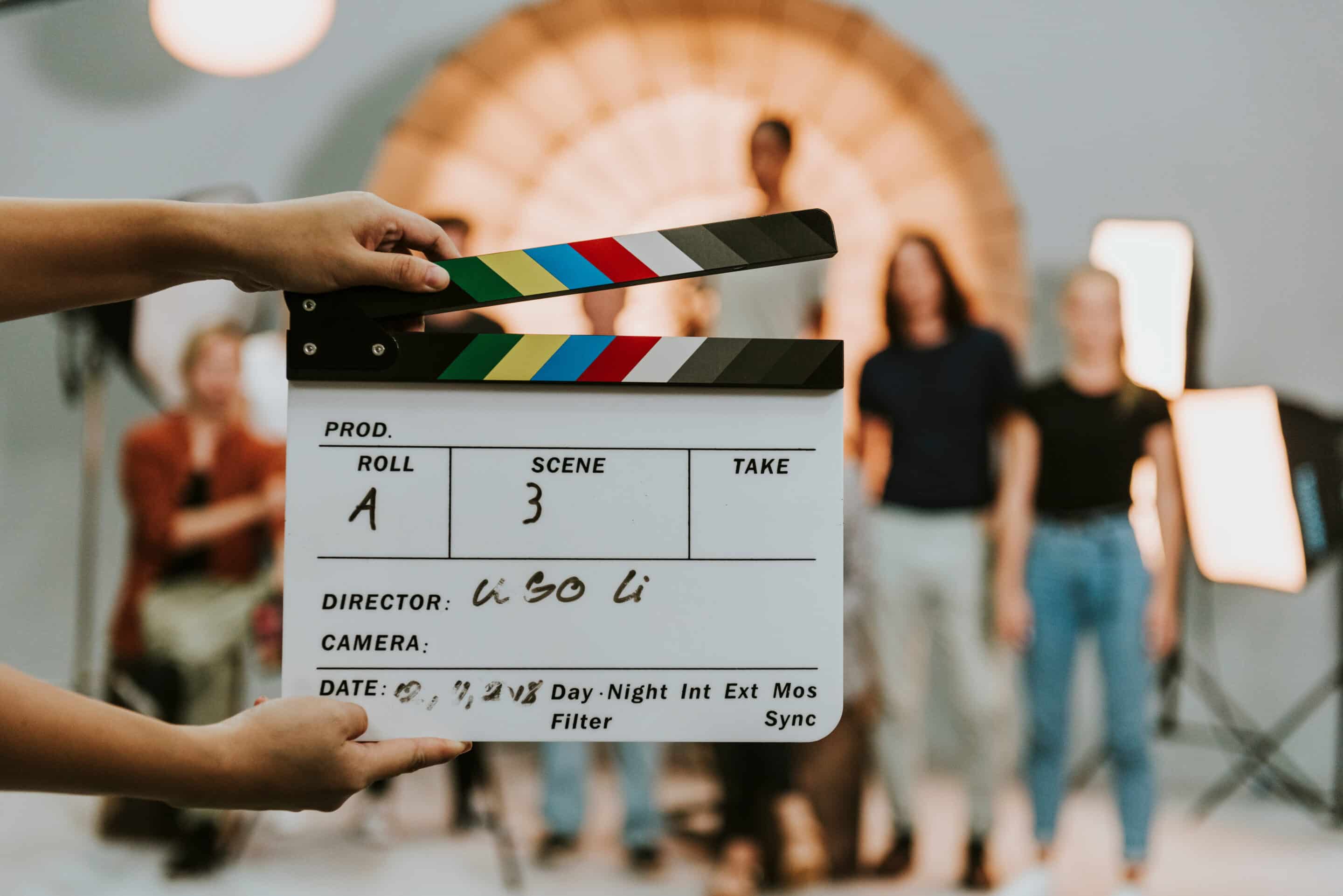 Line producer holding clapperboard