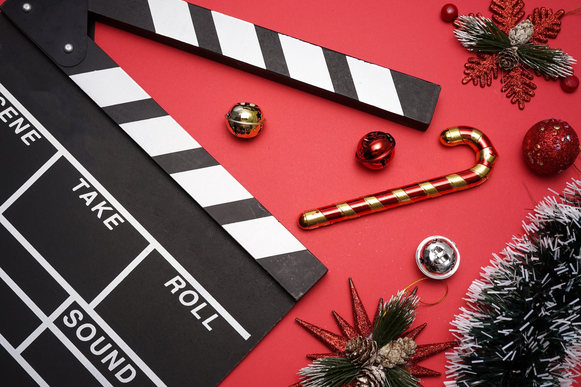 Filmmaker clapperboard with Christmas decorations shooting a Christmas commercial