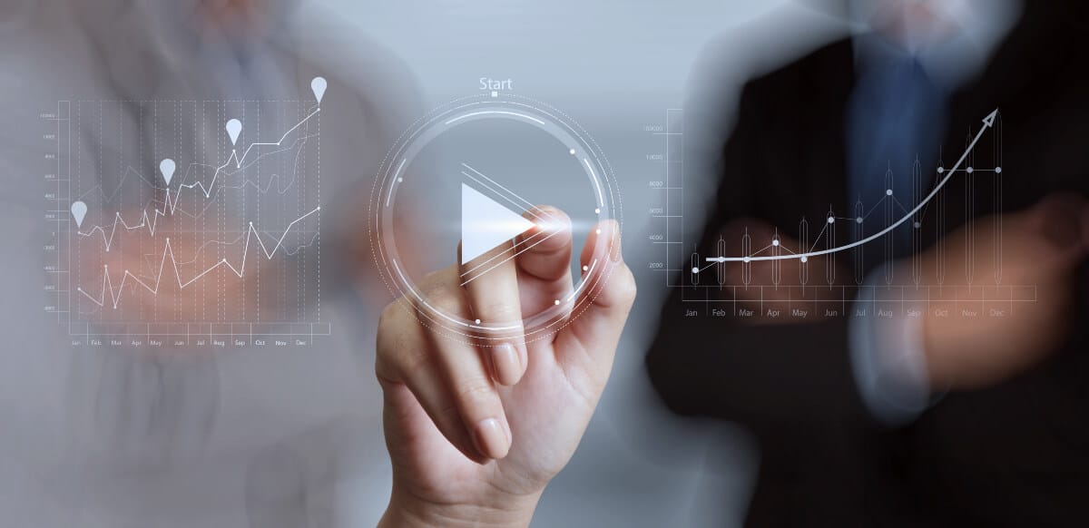 Hand pressing play on case study video showing analytics graphics