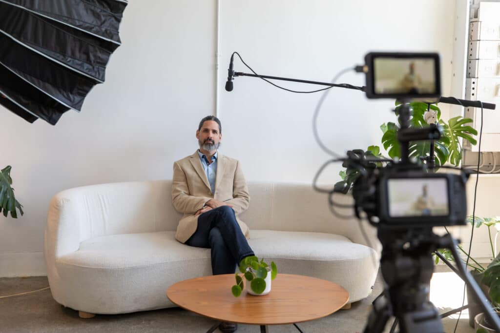 Man being interviewed for a customer testimonial video